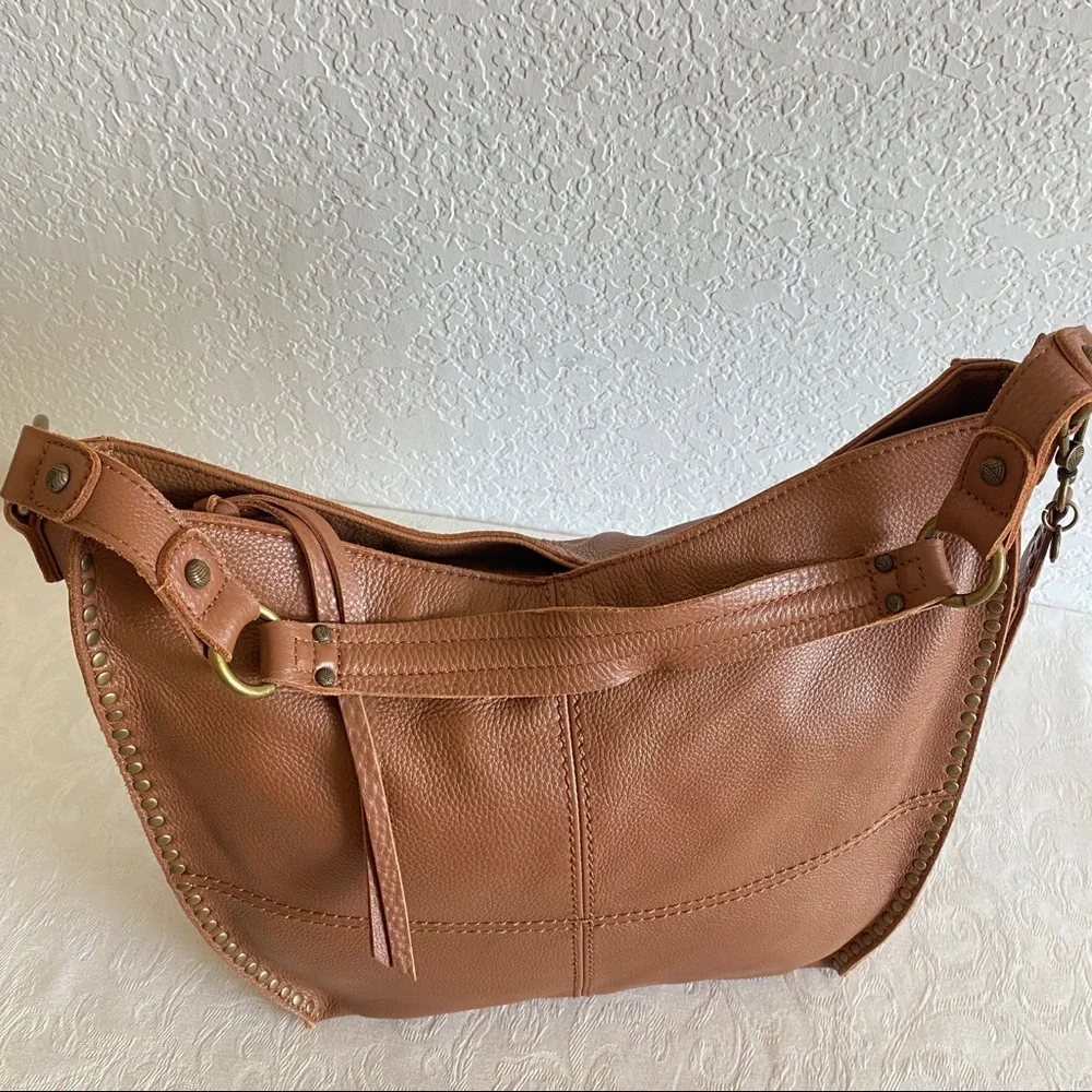 The sak brown leather studded hobo bag
